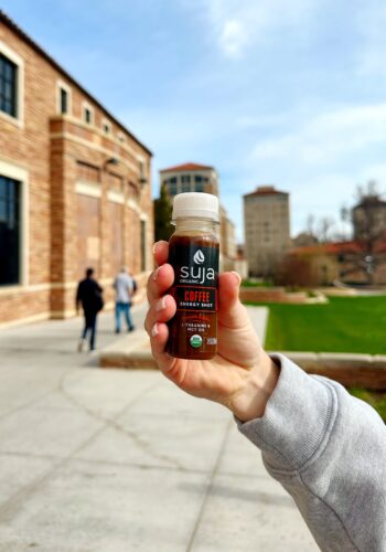 Suja Coffee shot in a hand